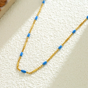 French vintage titanium steel necklace with gold beads and bright blue oval pendants