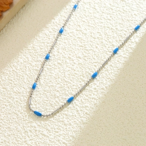 Minimalist titanium steel beaded necklace with elegant blue beads and silver spacers