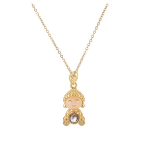 Detail of gold Buddha pendant necklace featuring pink cat eye stone and projection gem