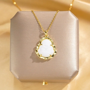 Elegant gold titanium steel necklace featuring a white Buddha pendant on a silk background