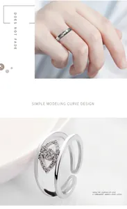 Détails de bagues en acier argenté avec un design multicouche incurvé et un œil en zircon