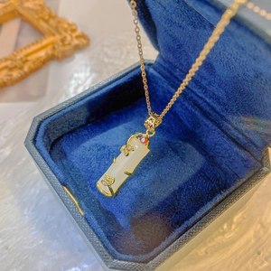 Bamboo style 18k gold plated necklace with white jade pendant and red gemstone detail