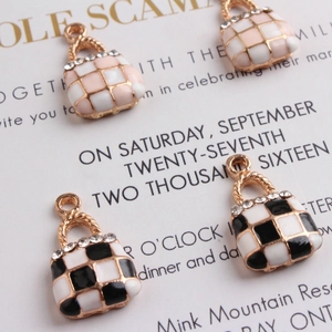 Quilted checkerboard alloy bag charms with pink and black enamel and sparkling crystals