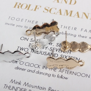 Polished wave texture earring posts in gold and silver finish with hanging loops