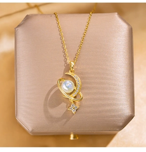 Close-up of golden moon and opal planet pendant with sparkling crystals on fine O-chain