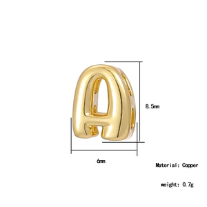 Macro detail of 18K gold plated copper letter A bead with 8.5mm height and 6mm width