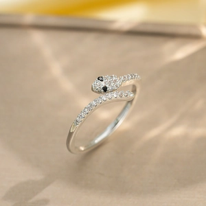 Elegant adjustable silver snake ring featuring sparkling pavé zircon and black gemstone eyes