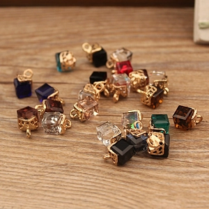 Colorful cube crystal pendants with golden hollow alloy hooks for DIY jewelry on wood