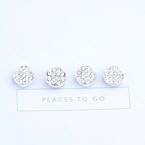 Set of four silver alloy round hair tie sliders encrusted with shimmering rhinestones