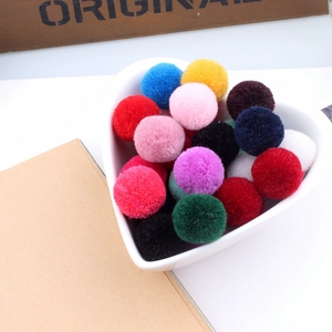 Set of 20mm colorful cashmere pompoms for DIY hair accessories in heart-shaped bowl