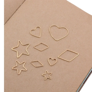 Golden geometric DIY jewelry charms in heart, star, and rhombus shapes for earrings