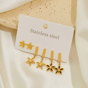 Set of three stainless steel flower earrings with gold finish and black enamel details