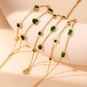 Double-layered gold stainless steel bracelet with green stars and heart faceted gemstones