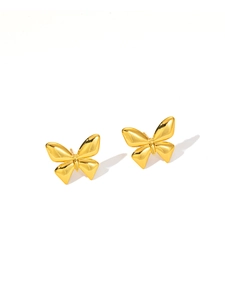 Detailed view of polished golden butterfly stud earrings with reflective finish