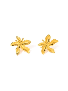 Detailed macro view of gold-plated stainless steel earrings with abstract lily petal design