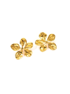 Macro detail of gold flower earrings with organic hammered metal texture and petal design