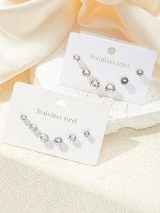Détail des ensembles de boucles d'oreilles en acier inoxydable avec zircons ronds