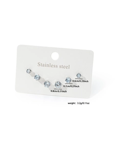Three pairs of light blue round-cut cubic zirconia studs in surgical stainless steel