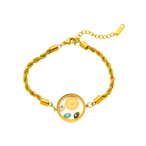 Macro shot of gold stainless steel bracelet with devil eye charms and coin pendant detail
