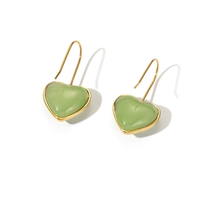 Elegant gold heart earrings with light green resin stones on a clean white background