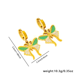 Detailed view showing dimensions of butterfly earrings with gold frame and green enamel