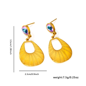 Detailed view of 18K gold butterfly earrings with blue-purple teardrop stones