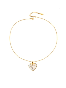 Detail of gold heart pendant with shell inlay and sparkling crystals on a fine chain