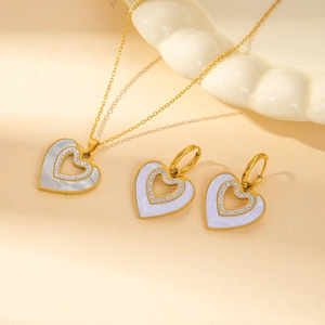 Elegant gold heart jewelry set with lavender shell inlay and crystal necklace earrings