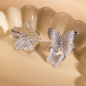Elegant silver butterfly and flower petal rings with detailed radial texture
