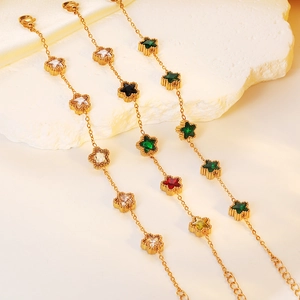 Macro shot of gold stainless steel multi-chain bracelet with colorful star gemstones