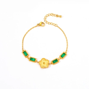 Golden titanium steel bracelet with emerald crystals and radiant five-petal flower charm