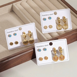 Ohrring-Set aus goldenem Edelstahl mit blauen Augen-Steckern und Muschel-Anhängern