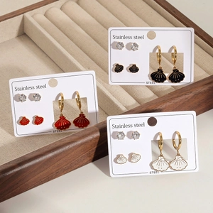 Drei Paar Edelstahl-Ohrring-Set mit Muschel- und Sterndesign und Zirkonia-Steckern