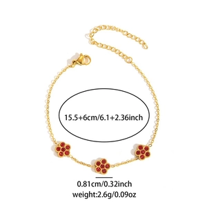 Goldenes Edelstahlarmband mit drei roten Strassblumen und verstellbarer Kette