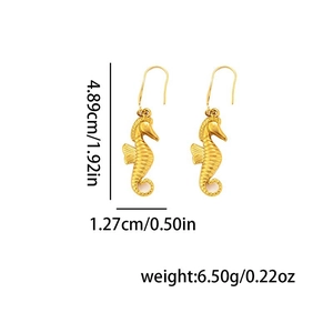 Detail view of gold seahorse dangle earrings showing dimensions and intricate scale texture