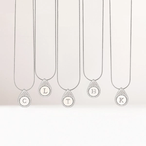 Elegant silver teardrop pendant necklaces with crystal letters C L T B K on snake chains