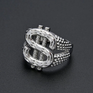 Macro view of silver dollar sign ring with textured band in punk hip-hop style