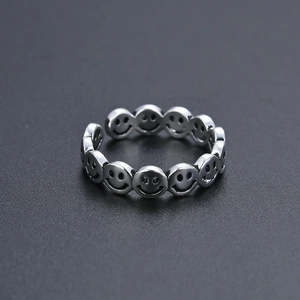 Macro detail of vintage silver smiley face ring band with retro oxidized finish