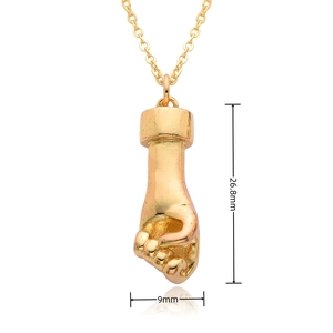 Close-up of golden hand gesture fico pendant with 26.8mm height and 9mm width dimensions