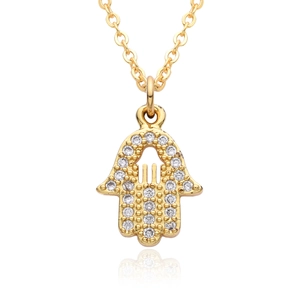 Close-up of golden Hamsa Hand pendant necklace with shimmering crystal pavé details
