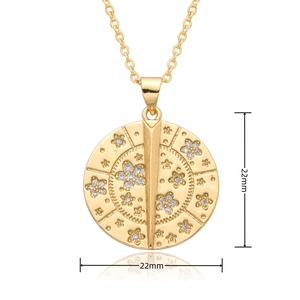 Detail of 22mm gold pendant necklace with floral relief pattern and sparkling crystals