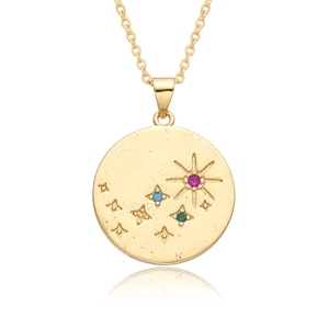 Macro detail of gold celestial coin pendant featuring colorful starburst crystal charms
