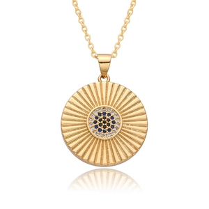 Golden coin necklace with sunburst texture and blue crystal evil eye pendant