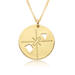 Detailed macro view of a gold circular cupid pendant necklace with diamond accents