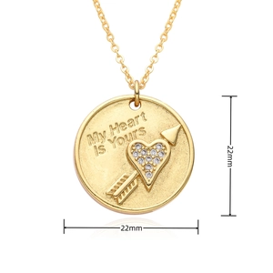 Detailed view of a 22mm gold pendant necklace featuring My Heart Is Yours engraving