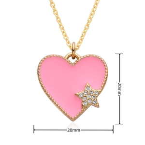 Detail of pink enamel heart pendant with gold beaded edges and star zircon inlay