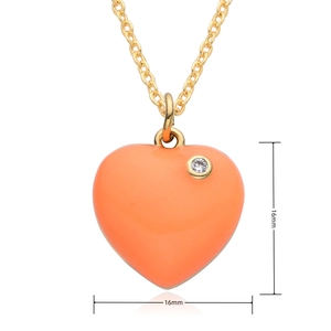 Detailed macro view of an orange heart pendant necklace with 16mm size markings