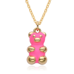 Close-up of pink gummy bear pendant with gold accents and 18K plated chain