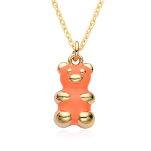 Close-up of golden bear pendant with orange resin coating and fine gold plated chain