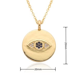 Detail view of 20mm gold-plated evil eye disk pendant necklace with blue cubic zirconia